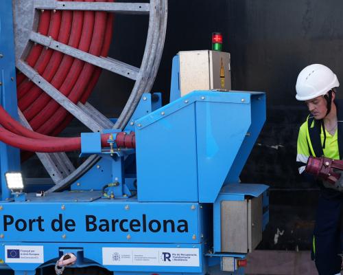 Two operators connect a ship to the OPS on the BEST terminal.